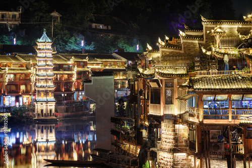 Night view of old traditional Chinese wooden riverside houses