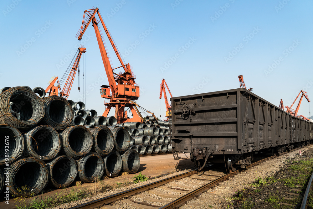 Naklejka premium Stacking steel and crane, in railway transportation
