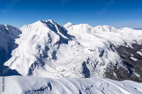 Beautiful mountains in the snow. © gubernat