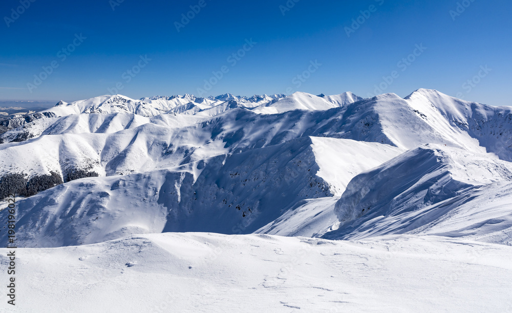 Mountain peaks covered with white snow.