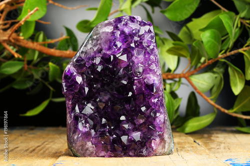 Amethyst geode on black background. Beautiful natural crystals gemstone.