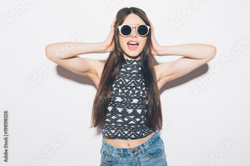 Amazed woman looking at camera isolated on a white background