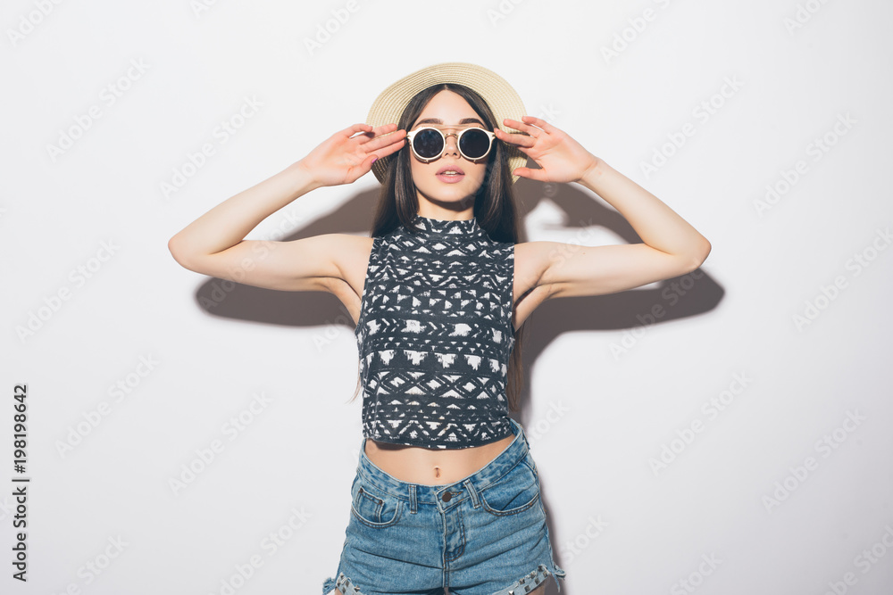 Portrait young beautiful attractive girl smiling looking at camera isolated on gray Portrait young beautiful attractive girl smiling looking at camera isolated on gray
