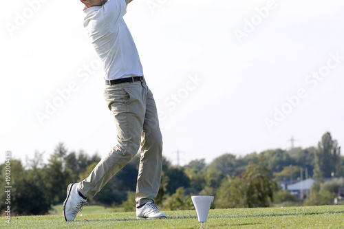 A golf player on a green