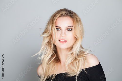 Female Model with Wavy Blonde Hairstyle. Woman Face