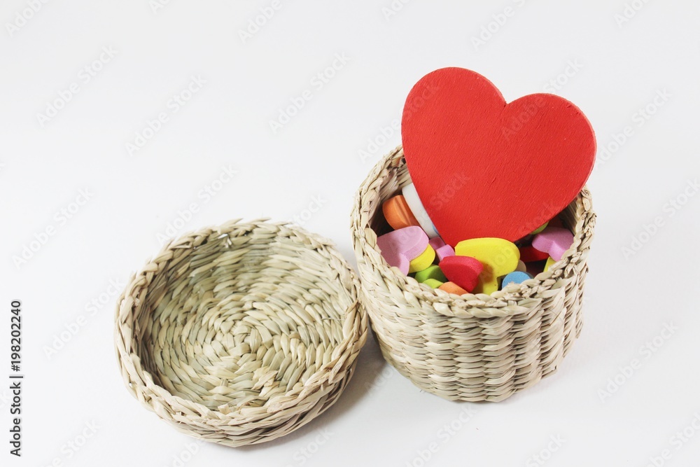 Red heart in straw basket.
