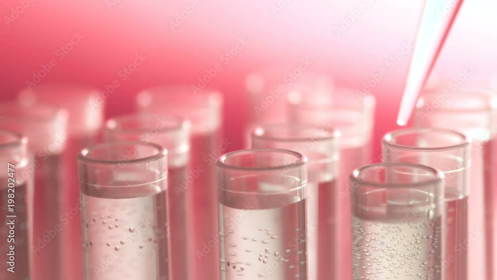 a scientist with a pipette analyzes a colored liquid to extract the DNA and molecules in the test tubes. a scientist with a pipette analyzes a colored liquid to extract the DNA and molecules in the test tubes.