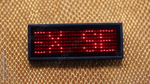 sliding text SEX flashing made with red LEDs photo