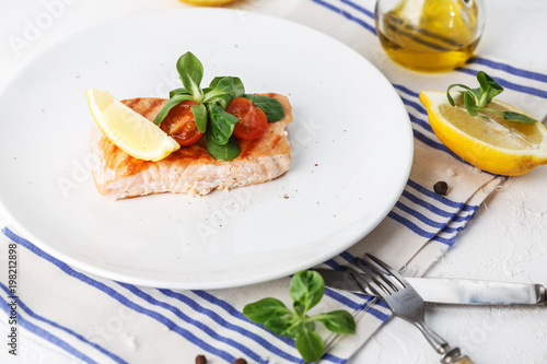 grilled salmon with cherry tomatoes and salad