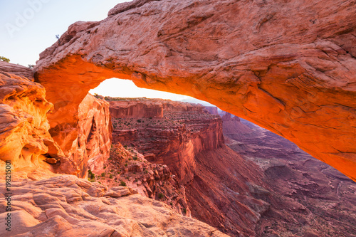 Beautiful Canyonlands view, from Mesa Arch, under warm surise light, on a clear autumn day