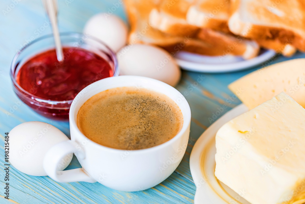 Breakfast with coffee, eggs, toasts, cheese, jam Breakfast with coffee, eggs, toasts, cheese, jam