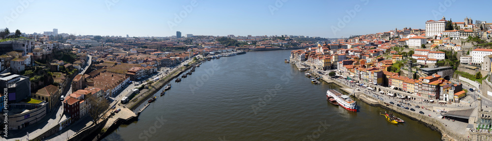 Panoramic image of the Douro River in Porto, Portugal. The image was made on the Dom Luis Bridge.  The Douro River separates the cities Porto and Vila Nova de Gaia.