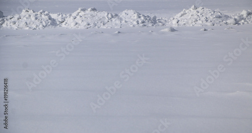 snow. texture of snow and drifts in the field. snow on a sunny day after a snowfall. © Оксана Скиданова