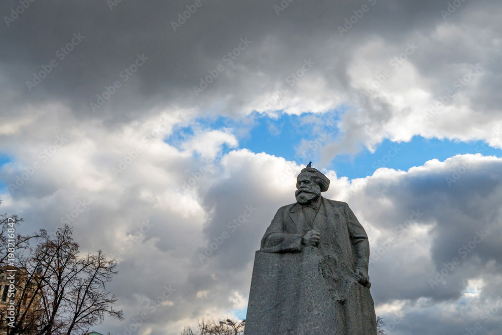 Karl Marx statue in Moscow against cloudy sky