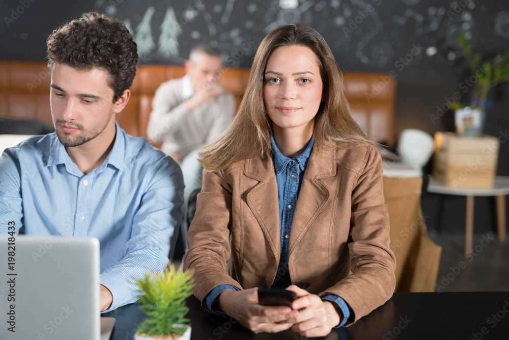 Fototapeta premium Young teamwork in a cafe