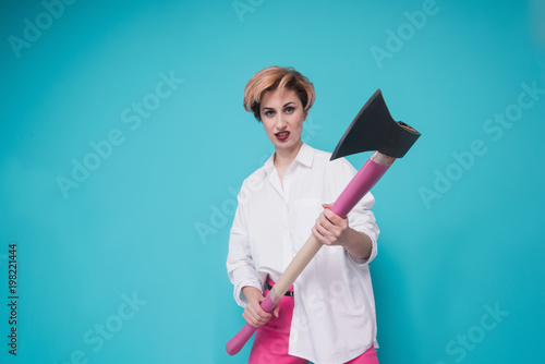 Angry furious businesswoman girl with an ax, screaming. Negative human emotions, facial expressions, feelings, aggression, anger management issues concept