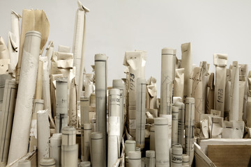 Old architectural plans piled up