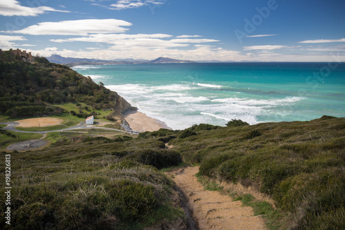 scenic hike on coastal footpath in bidart with view on atlantic ocean, basque country, france photo