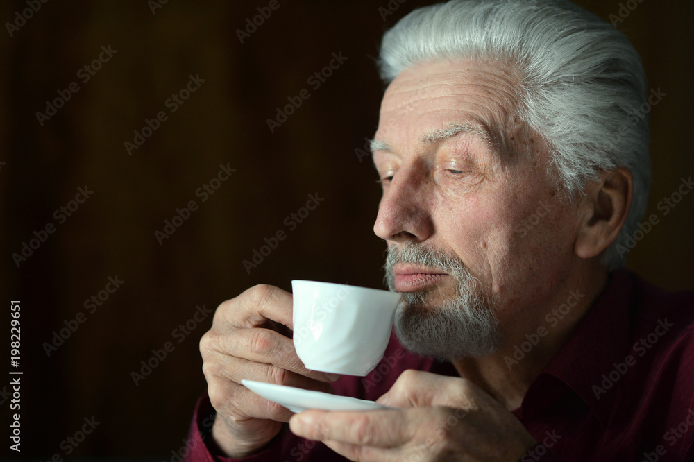 Portrait of senior man drinking Portrait of senior man drinking
