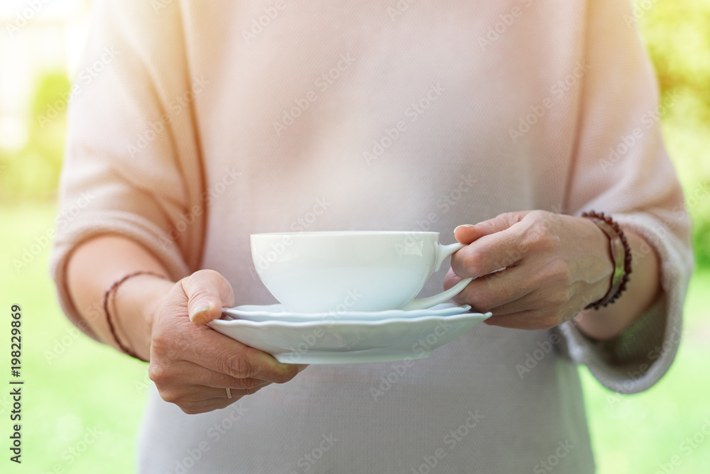 Cup of tea in woman hands Cup of tea in woman hands