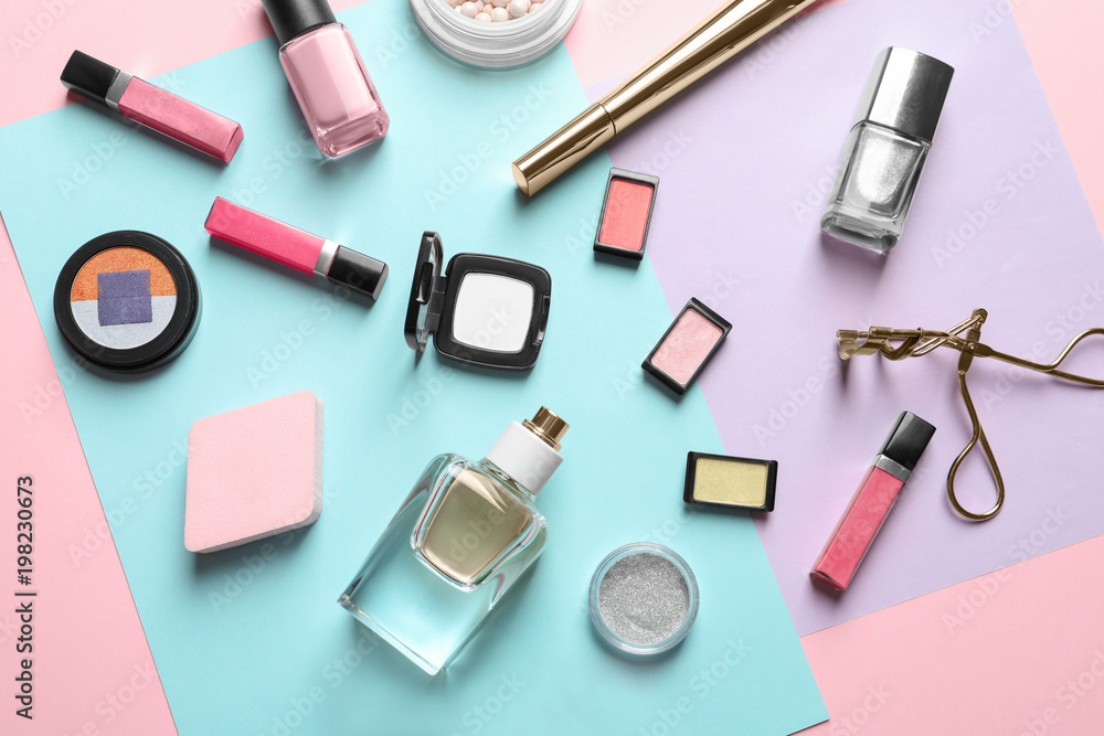 Obraz premium Decorative cosmetics and tools of professional makeup artist on color background