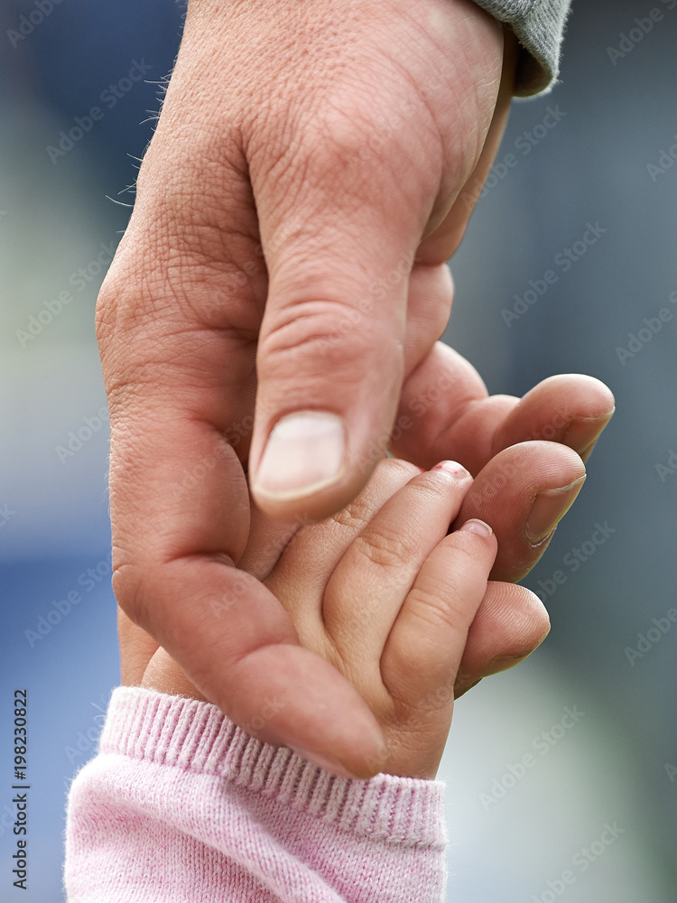 Fototapeta premium Child and parent holding hands