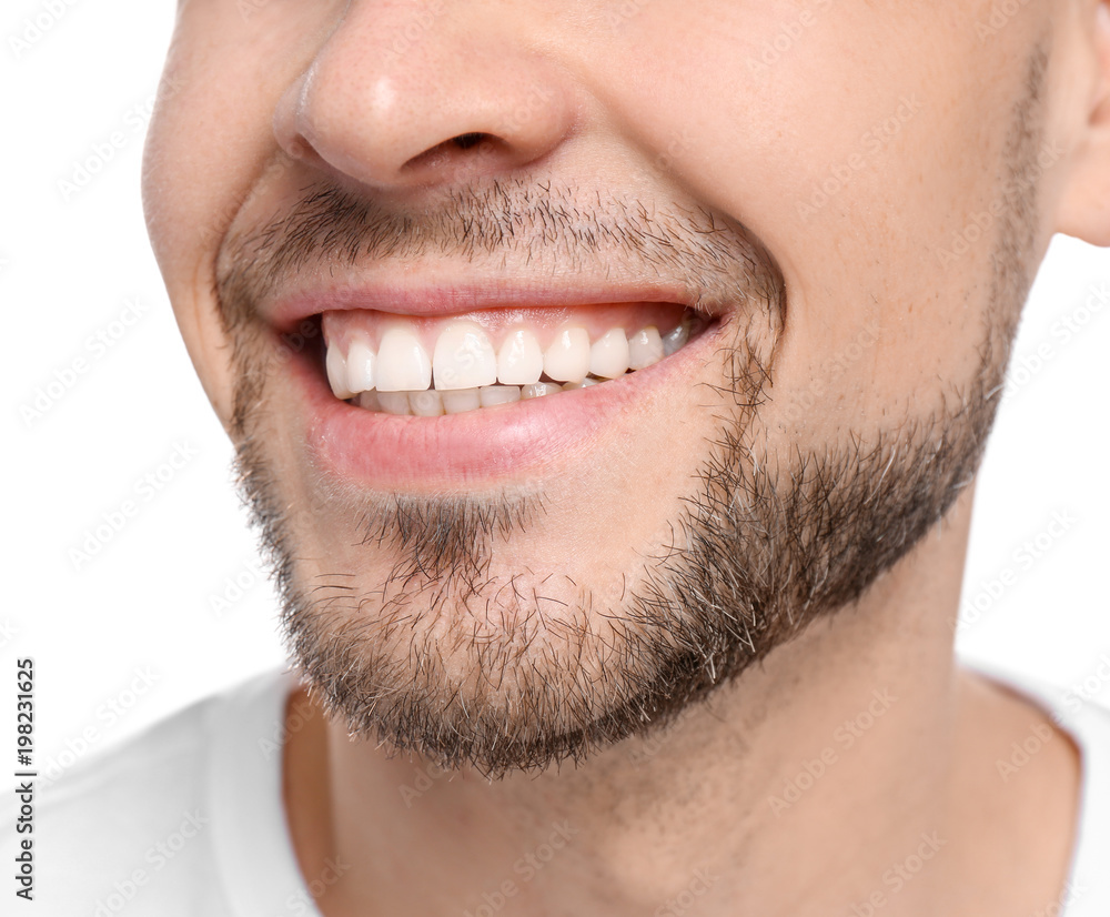 Young man with beautiful smile on white background. Teeth whitening Young man with beautiful smile on white background. Teeth whitening