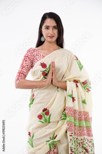 Young Indian woman greeting with folded hands