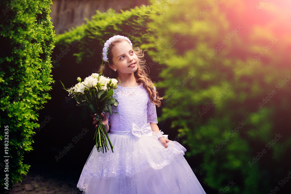 Lovely little bridesmaid standing outdoors Lovely little bridesmaid standing outdoors
