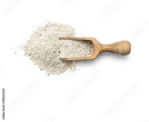 Buckwheat flour in scoop on white background