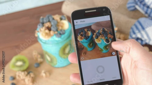 taking instagram food photo with cellphone, blue majik smoothie, superfood photo