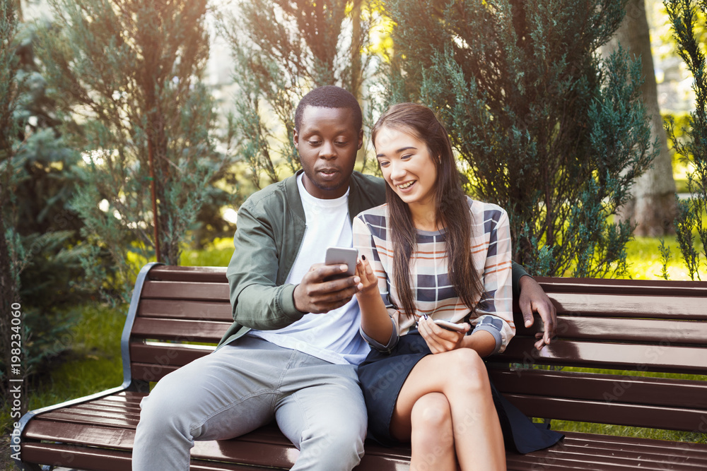 Couple sharing media in smartphone copy space Couple sharing media in smartphone copy space