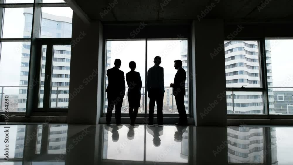 Business team of managers standing talk in office Business team of managers standing talk in office