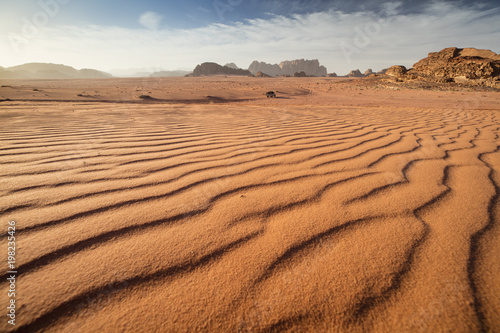 view to desert landscape with sand dunes in sunset time in Jordan