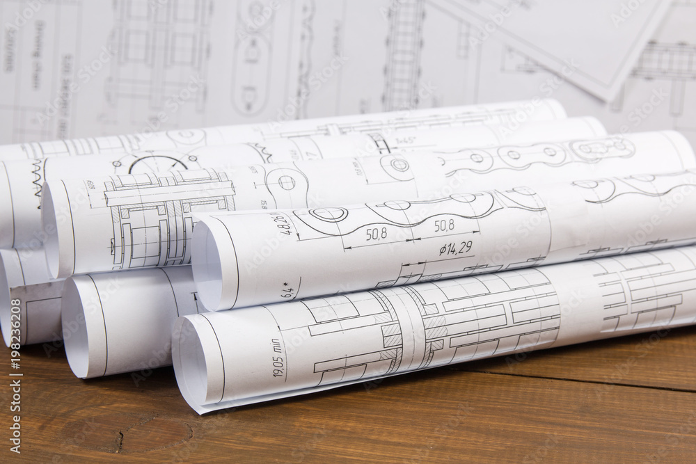 Engineer drawings on the table. Engineer drawings on the table.