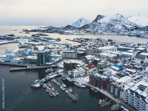 Beautiful super wide-angle winter snowy view of Svolvaer, Norway, Lofoten Islands, with skyline, mountains, Austvagoya island, Vagan municipality, Nordland, Northern Norway photo