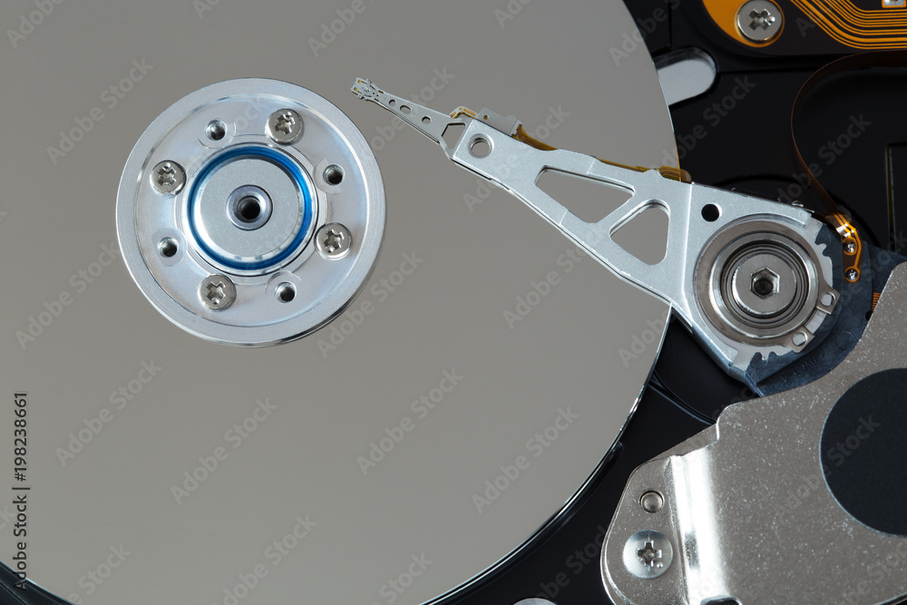 Computer hard disk - interior with visible plate and laser Computer hard disk - interior with visible plate and laser