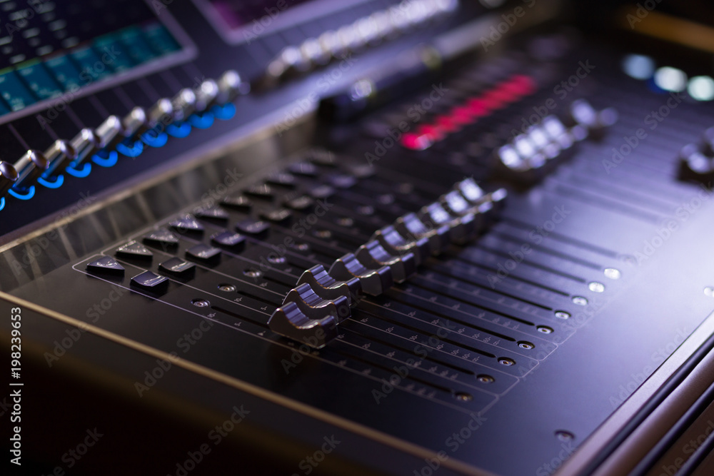 Music mixer with black sliders and red and blue elements Music mixer with black sliders and red and blue elements