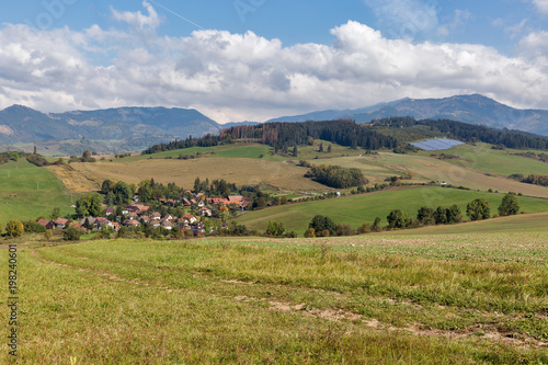 Summer hills landscape with Benusovce village in Slovakia.