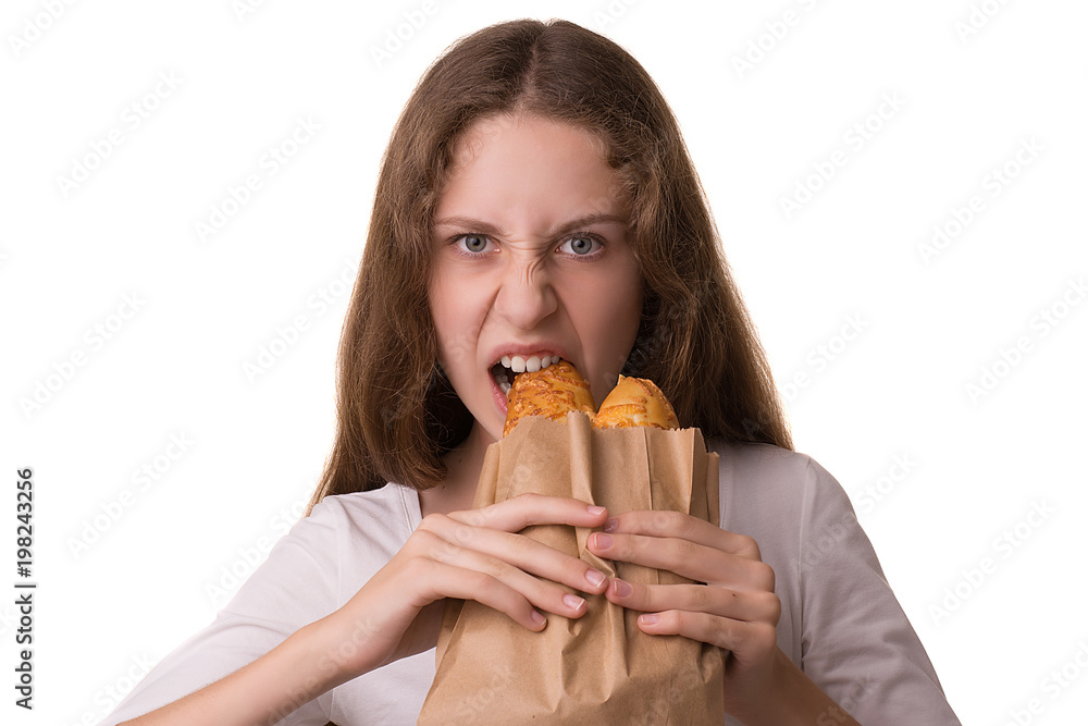 Beautiful girl eats buns. Studio portrait on white background. Beautiful girl eats buns. Studio portrait on white background.