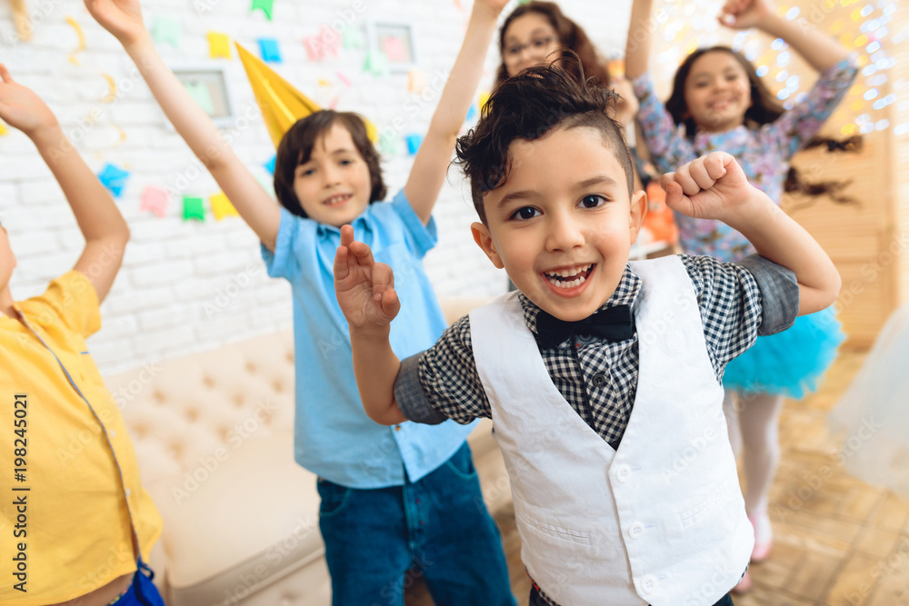 Little jouful children dance at birthday party. Little children on birthday celebrations. Little jouful children dance at birthday party. Little children on birthday celebrations.