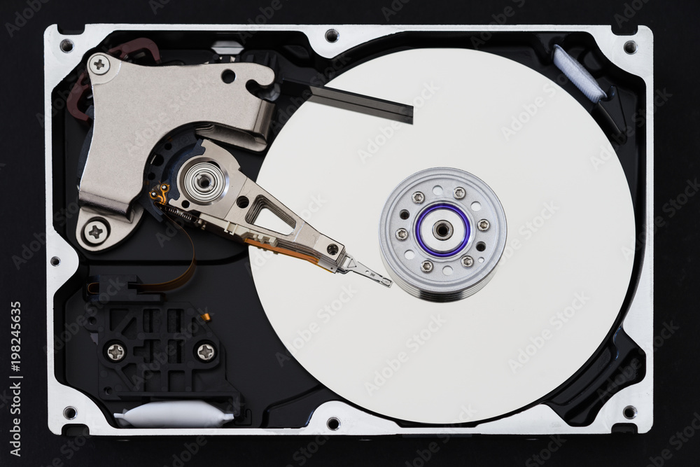 Hard disk with cover, hdd inside flat view, spindle, actuator arm, read write head, platter, ribbon cable Stock-foto | Adobe