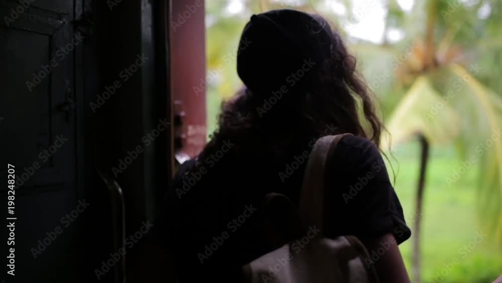 the girl is traveling by train at Sri Lanka. the girl is traveling by train at Sri Lanka.