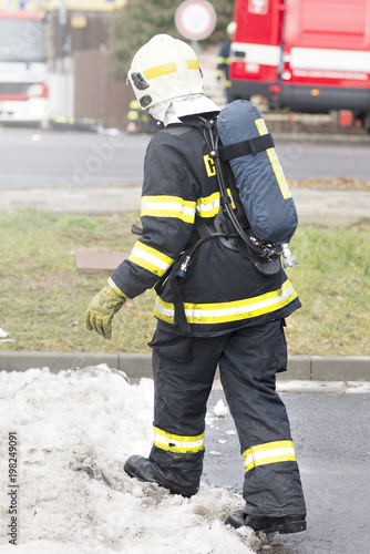 Fireman with breathing apparatus going into an action. Real fire scene. Czech Republic