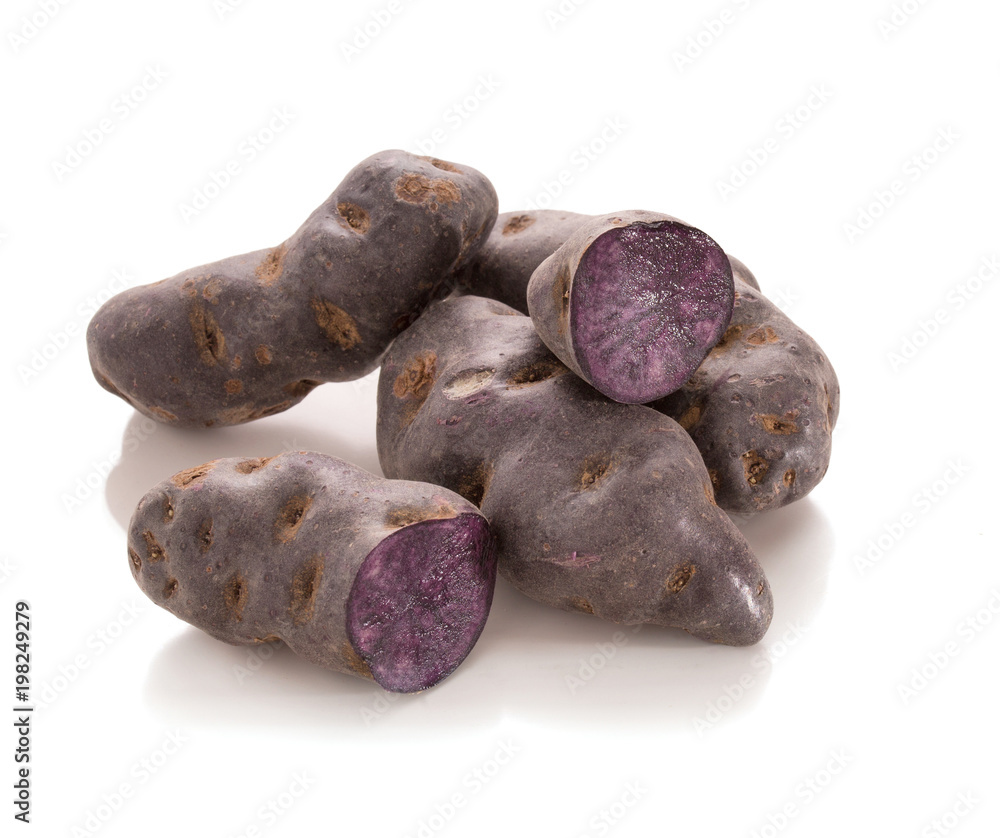 Vitelotte, purple potato in piles Vitelotte, purple potato in piles
