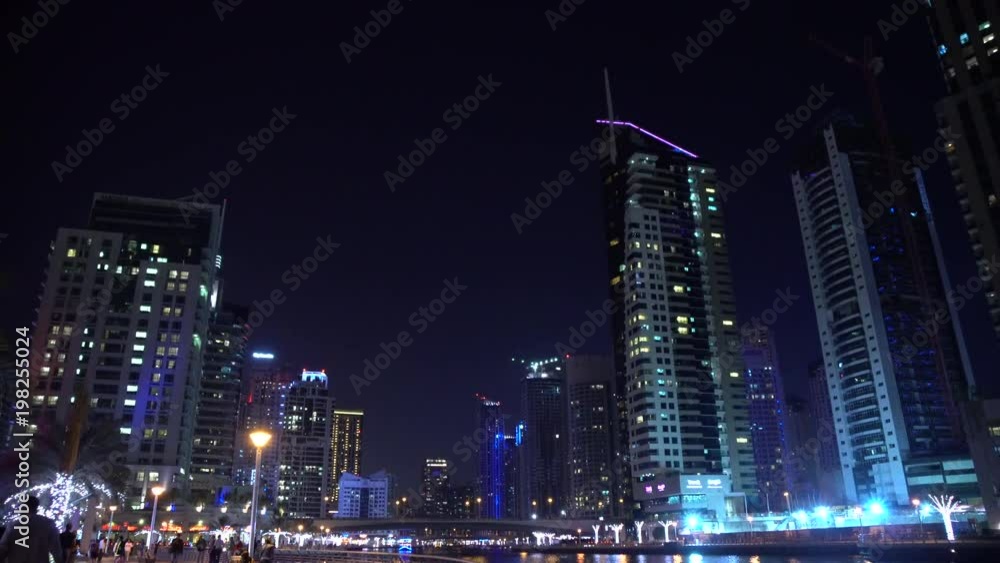 Skyscrapers and waterfront in Dubai Marina at night Skyscrapers and waterfront in Dubai Marina at night