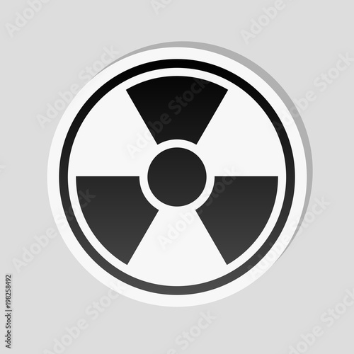 hazard, radiation. simple silhouette. Sticker style with white border and simple shadow on gray background