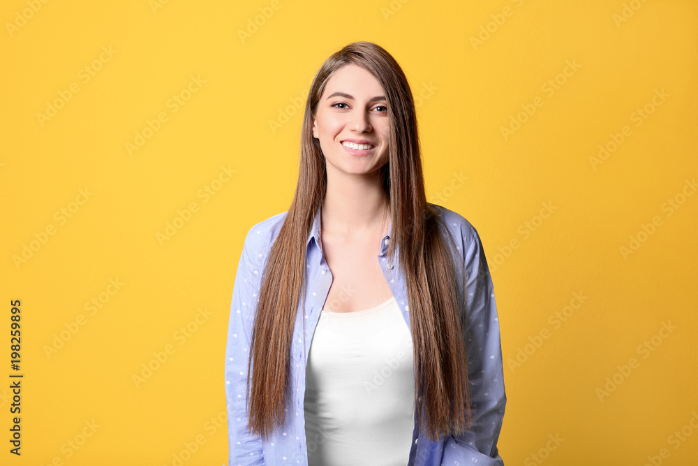 Portrait of young woman with long beautiful hair on color background Portrait of young woman with long beautiful hair on color background