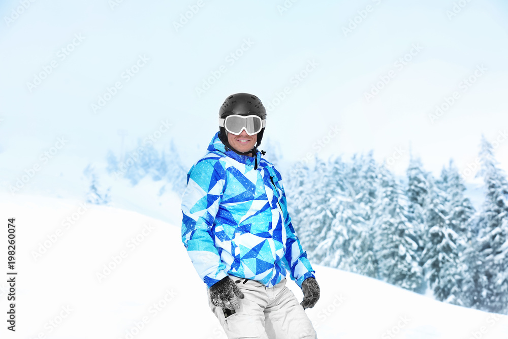 Man on ski piste at snowy resort. Winter vacation Man on ski piste at snowy resort. Winter vacation
