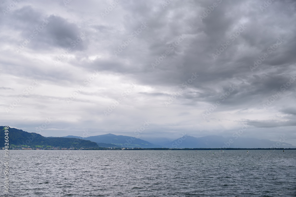 Beautiful panorama of the Alps at lake Constance known as Bodensee in Germany on cloudy autumn day